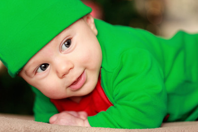 46% OFF on Child's Love - Cute Little Baby in a Green Get-up Paper Print