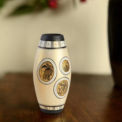 44% OFF on ExclusiveLane Handpainted Madhubani Dholak Natural Terracotta Vase 44% OFF on ExclusiveLane Handpainted Madhubani Dholak Natural Terracotta Vase